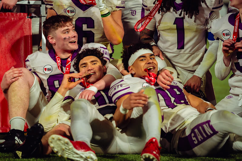 American football players celebrating with medals after a BUCS championship final