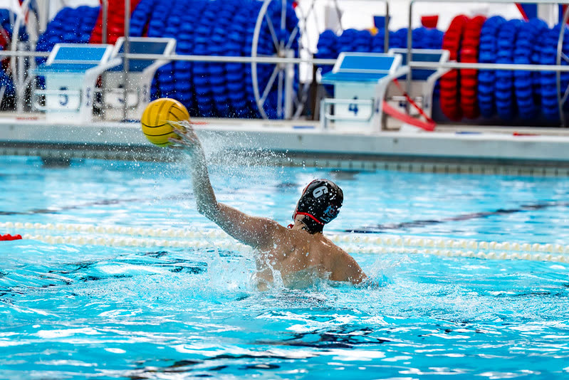 A university water polo player shooting during a BUCS match