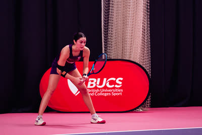 A university tennis player waiting to receive serve at a BUCS event