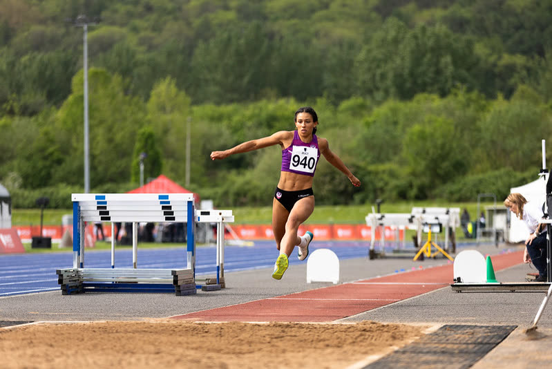 A university athlete competing in a track and field event